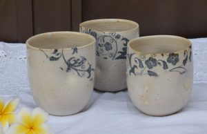 three flowers decorated ceramic cups